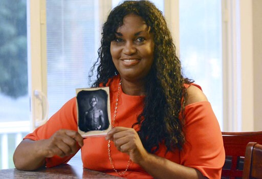 Harvard profits from early photos of slaves, lawsuit says