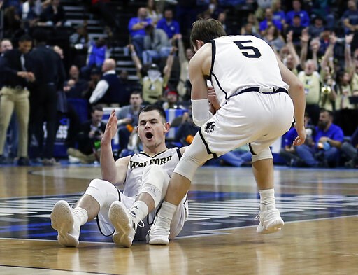 Magee sets record, Wofford tops Seton Hall for 1st NCAA win