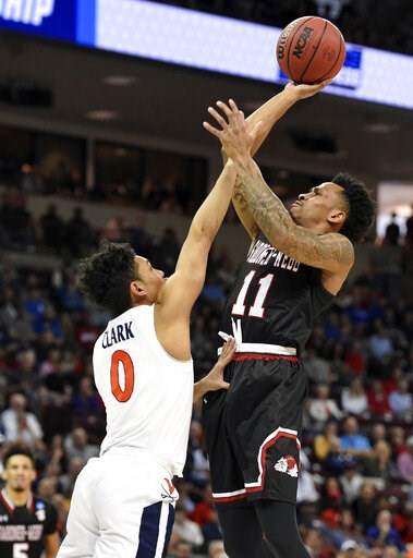 No. 1 Virginia avoids 2nd straight huge NCAA tourney upset
