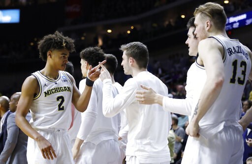 Michigan returning to Sweet 16 after toppling Florida 64-49