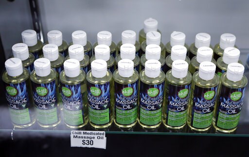 (AP Photo/Carlos Osorio, File). FILE - In this Nov. 7, 2018, file photo, bottles of massage oil with cannabidiol (CBD) and tetrahydrocannabinol (THC), two natural compounds found in plants of the Cannabis genus, are displayed at the Far West Holistic C... (AP Photo/Carlos Osorio, File). FILE - In this Nov. 7, 2018, file photo, bottles of massage oil with cannabidiol (CBD) and tetrahydrocannabinol (THC), two natural compounds found in plants of the Cannabis genus, are displayed at the Far West Holistic C...