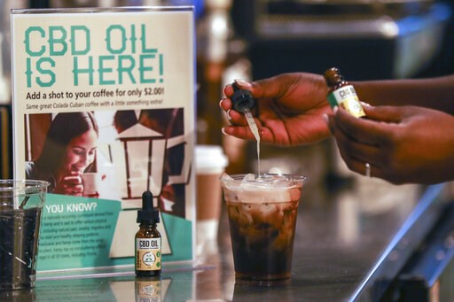 (Jennifer Lett/South Florida Sun-Sentinel via AP, File). FILE - In this Jan. 4, 2018, file photo, a worker adds cannabidiol (CBD) to a drink at a coffee shop in Fort Lauderdale, Fla. Mainstream retailers are leaping into the world of products like skin... (Jennifer Lett/South Florida Sun-Sentinel via AP, File). FILE - In this Jan. 4, 2018, file photo, a worker adds cannabidiol (CBD) to a drink at a coffee shop in Fort Lauderdale, Fla. Mainstream retailers are leaping into the world of products like skin...