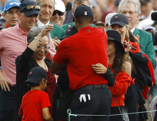 (AP Photo/Matt Slocum). Tiger Woods hugs his family after winning the Masters golf tournament Sunday, April 14, 2019, in Augusta, Ga. (AP Photo/Matt Slocum). Tiger Woods hugs his family after winning the Masters golf tournament Sunday, April 14, 2019, in Augusta, Ga.