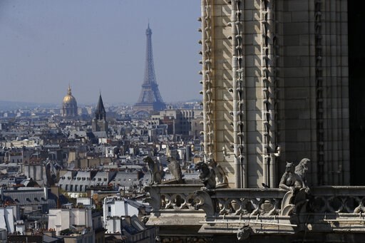 (AP Photo/Francois Mori). View from the top of the Paris' Notre Dame Cathedral with the Eiffel Tower in background as the religious statues descend to earth for the first time in over a century as part of a restoration, in Paris Thursday, April 11, 201... (AP Photo/Francois Mori). View from the top of the Paris' Notre Dame Cathedral with the Eiffel Tower in background as the religious statues descend to earth for the first time in over a century as part of a restoration, in Paris Thursday, April 11, 201...