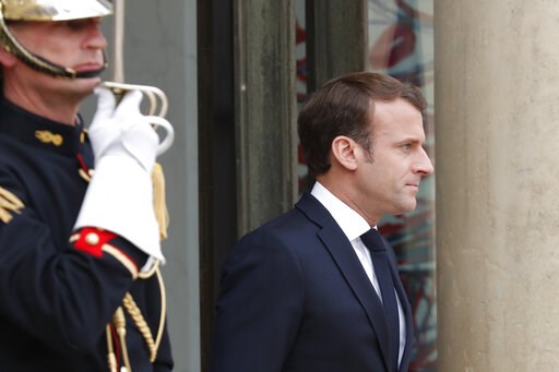 Macron offers tax cut to French workers to quell anger