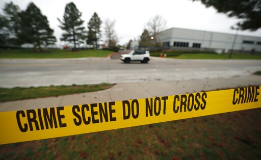 The Latest: Hundreds gather for school shooting vigil