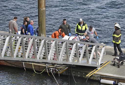 (Dustin Safranek/Ketchikan Daily News via AP). Emergency response crews transport an injured passenger to an ambulance at the George Inlet Lodge docks, Monday, May 13, 2019, in Ketchikan, Alaska. The passenger was from one of two sightseeing planes rep... (Dustin Safranek/Ketchikan Daily News via AP). Emergency response crews transport an injured passenger to an ambulance at the George Inlet Lodge docks, Monday, May 13, 2019, in Ketchikan, Alaska. The passenger was from one of two sightseeing planes rep...