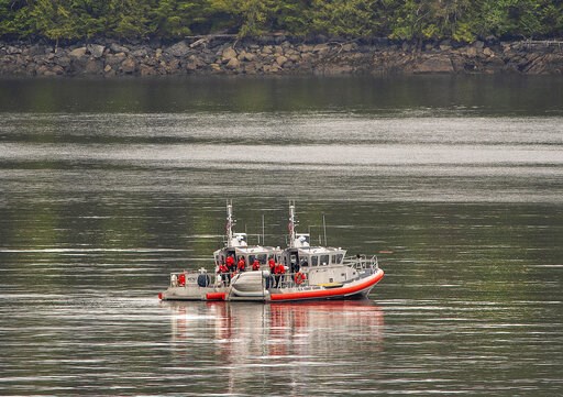 (Dustin Safranek/Ketchikan Daily News via AP). Two U.S. Coast Guard 45-foot response boats drift through George Inlet as part of a search effort on Tuesday, May 14, 2019, near Ketchikan, Alaska, at the site of a collision between two float planes. Dive... (Dustin Safranek/Ketchikan Daily News via AP). Two U.S. Coast Guard 45-foot response boats drift through George Inlet as part of a search effort on Tuesday, May 14, 2019, near Ketchikan, Alaska, at the site of a collision between two float planes. Dive...