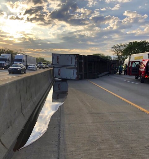 Semi-trailer hauling honey overturns along Indiana highway