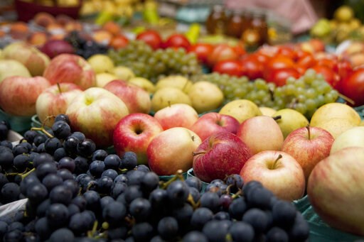 (Katie Alaimo/Kalamazoo Gazette via AP). FILE - In this Sept. 18, 2014 file photo, produce is displayed for sale at a farmers market in Kalamazoo, Mich. A study released on Wednesday, May 15, 2019 suggests that trimming dietary fat and eating more frui...