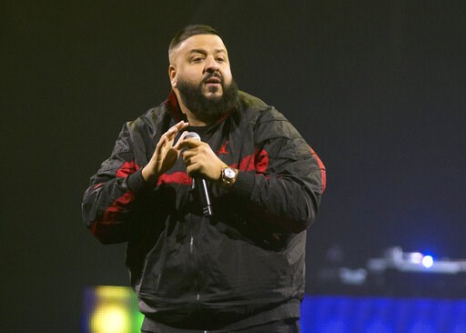 (Photo by Owen Sweeney/Invision/AP, File). FILE - In this March 23, 2018 file photo, DJ Khaled performs as the opening act for Demi Lovato during her "Tell Me You Love Me World Tour" in Philadelphia. Khaled is releasing a single with Nipsey Hussle that...