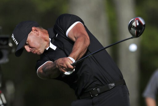 The Latest: Koepka holds on, wins PGA Championship again