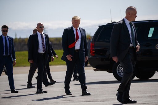 The Latest: Trump, in Japan, needles US ally over trade