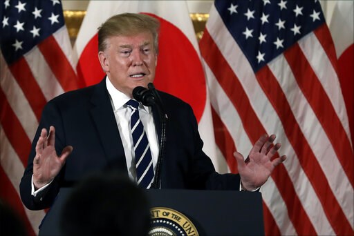 Trump's trophy day of sumo, golf and cheeseburgers in Japan