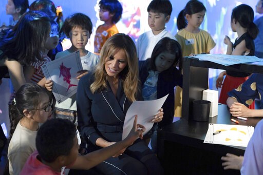 Melania Trump colors fish with kids at Japan digital museum