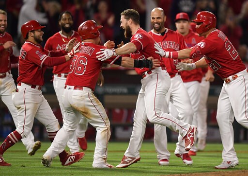 Calhoun rallies Angels past Rangers 3-2 to snap 5-game skid