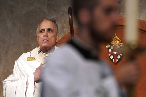 Allegations against top priest under review after AP report