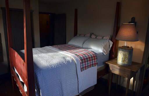 (Craig Cunningham/The Daily Mail via AP, File). FILE - This Nov. 11, 2013 file photo shows a bedroom in Belle, W.Va. According to U.S. preliminary research published Tuesday, June 4, 2019, dozing off to late-night TV or sleeping with other lights on ma...