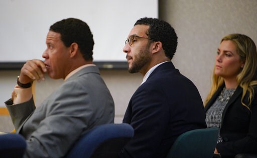 (Nelvin C. Cepeda/The San Diego Union-Tribune via AP, Pool). Sitting in Superior Court in Vista, Kellen Winslow, Jr., is flanked by two of his three defense attorneys, Brian Watkins, left, and Elizabeth Bahr, right, as he listens to closing arguments t... (Nelvin C. Cepeda/The San Diego Union-Tribune via AP, Pool). Sitting in Superior Court in Vista, Kellen Winslow, Jr., is flanked by two of his three defense attorneys, Brian Watkins, left, and Elizabeth Bahr, right, as he listens to closing arguments t...
