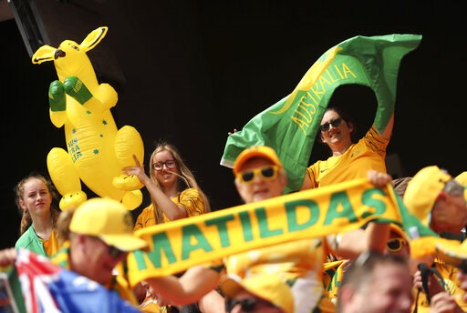 (AP Photo/Francisco Seco). Australia's fans cheer for their team prior the start of the Women's World Cup Group C soccer match between Australia and Italy at the Stade du Hainaut in Valenciennes, Sunday, June 9, 2019.