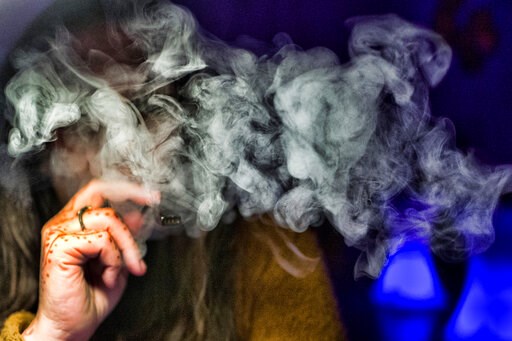 (AP Photo/Richard Vogel). FILE - In this Saturday, Dec. 22, 2018 file photo, a woman takes a puff from a cannabis vape pen in Los Angeles. On Friday, Sept. 6, 2019, U.S. health officials are again urging people to stop vaping until they figure out why ... (AP Photo/Richard Vogel). FILE - In this Saturday, Dec. 22, 2018 file photo, a woman takes a puff from a cannabis vape pen in Los Angeles. On Friday, Sept. 6, 2019, U.S. health officials are again urging people to stop vaping until they figure out why ...