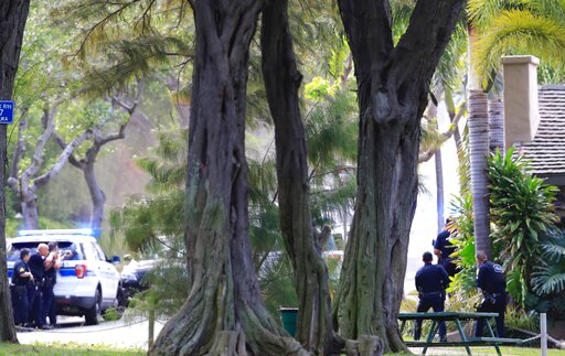 Homes burn after shooter kills 2 Honolulu officers