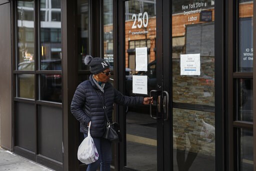 (AP Photo/John Minchillo). Visitors are unable to gain access to the Department of Labor due to closures over coronavirus concerns, Wednesday, March 18, 2020, in New York. Applications for jobless benefits are surging in some states as coronavirus conc... (AP Photo/John Minchillo). Visitors are unable to gain access to the Department of Labor due to closures over coronavirus concerns, Wednesday, March 18, 2020, in New York. Applications for jobless benefits are surging in some states as coronavirus conc...