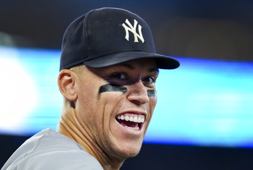 Judge 4 walks, still at 60 HR; Yankees win AL East, top Jays