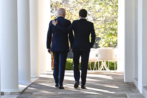 Biden, Macron vow unity against Russia, discuss trade row