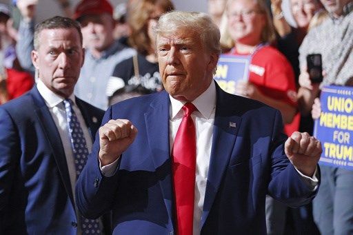 Trump goes to Michigan to rail against Biden's electric vehicle push while GOP rivals debate